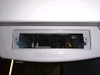 HP C2685A 2500CM printer underside/bottom access panel open showing internal electronics, wiring harness, and MJD-labeled connector board