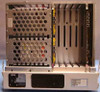 Octel Aspen Branch XP interior view with chassis open showing power supply module, card cage with expansion slots, and installed cards on backplane