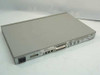 Bay Networks BayStack 101 rear panel angled view showing power inlet, Management Extension In/Out RJ-45 ports, and expansion module bays