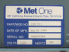 Met One 130-115 Data Multiplexer – close-up of rating plate label showing Part/Mod No. 130-115, Date of Mfr. March 1994, Serial No. 940891941, Volts 115V, Hertz 60
