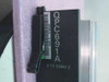 Nortel QPC691A module label closeup — showing model number QPC691A, barcode, and '5/12 CONV 2' designation printed on the card edge bracket