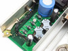 Nortel QPC691A PCB detail — close-up of power transistor section showing QHP202A4 transistors dated 8818K, small electrolytic and ceramic capacitors, and trim potentiometer