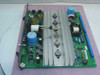Nortel Meridian QPC691A 5/12V Power Converter Module — top-side PCB view showing large aluminum heatsink fins, power transistors, and blue electrolytic capacitors
