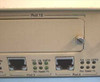 NBase NH 2012 front panel — Ports 3 and 4 RJ-45 with per-port LED indicators; Port 10 expansion slot above with captive screw