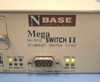 NBase Communications Mega Switch II NH 2012 label — model name, DB-9 Console Mgmt port, SNMP and Power LEDs, Mgmt and Fault indicators visible