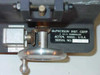 McPherson Instrument Corp. nameplate close-up showing manufacturer name, GCA subsidiary designation, Acton Massachusetts USA, serial number, and gear/drive mechanism detail