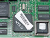 US Robotics Sportster 28800 — close-up of main DSP controller chip with inventory barcode sticker and ISSI SRAM chips visible