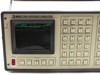 Kode TIA Model 2001 close-up of CRT display showing green trace with Display, Store/Recall, Analysis, and Readout Mode key sections
