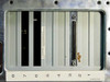 Rear I/O panel close-up — expansion slot covers and SCSI/parallel connector visible with adhesive residue present