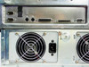 Rear I/O port detail — dual DB-9 serial ports, parallel port, SCSI connector, and PS/2-style connectors; surface spot of rust visible near fan housing