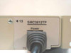 SMC3812TP model number label and power connector close-up on right side panel, with FCC marking visible