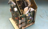 Simplex 1302 time clock – additional internal view showing circuit board stack, ribbon cables, and electromechanical components