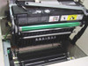 Sun QA-6 SPARCprinter interior with top cover open — drum unit, green toner roller, paper feed rollers, and internal mechanism visible