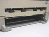 Sun QA-6 SPARCprinter paper output tray area — front lower section open showing paper feed path and roller assembly