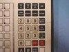 Snap Systems 4 POS keypad close-up — function keys including Sign On, Sign Off, Earned, Account, Balance Inquiry, Subtotal, Tend