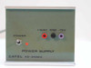 Catel PS-2500A power supply front panel closeup — toggle power switch, red power LED, and +12.6V, GND, -15V banana jack outputs labeled