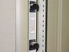 Interior rack rail outlet strip – two IEC outlets labeled 6A max per outlet, 12A combined, 10V-210V