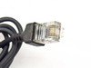 Second close-up view of RJ-11 phone cable connector from IBM PCMCIA modem kit showing connector detail