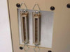 ADIC VLS-8MM rear panel showing two 68-pin SCSI connectors with bail-latch hardware