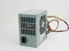 Packard Bell 190312 Lite-On PS-5101-2B 90W ATX power supply — rear view showing IEC AC inlet, fan exhaust grille, and voltage select switch