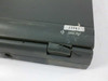 Close-up of broken right hinge on Acer 750C Note Laptop showing cracked plastic