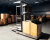 Clark OP15 electric order picker forklift – right three-quarter view inside warehouse showing full mast height and battery compartment cover