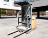 Clark OP15 counterbalanced electric order picker forklift – left side view outdoors showing mast, overhead guard, and forks