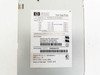HP D8520-63001 power supply label showing part numbers, input/output specs, and serial number