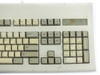 Dell AT101 keyboard – right side close-up showing function keys F9–F12 and worn asset tag sticker