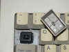 Dell AT101 keyboard – close-up of missing keycap exposing mechanical switch with rust on switch plate