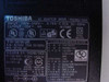 Toshiba PA3048U-1ACA rating plate closeup showing 100-240V input, 15V 4A output, UL and CE certifications
