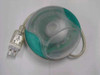 Apple M4848 USB one-button mouse in teal color — top view showing translucent shell and USB cable