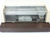 NBS Model 306 card imprinter – front view with clear cover open showing imprint carriage and NBS logo plate