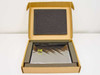 Toshiba P000272230 LCD panel in open cardboard box with foam padding inserts, screen wrapped in anti-static bag