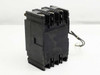 Fuji Electric BU-ESB3015 circuit breaker — left side view showing molded housing and attached white lead wire
