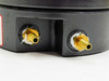 Dwyer Magnehelic 2000-0 C — close-up of two brass barb pressure port fittings at bottom of housing with thread sealant visible