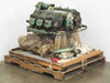 Franklin PZL 6A-350-C1 aircraft engine on pallet, opposite three-quarter view showing exhaust ports and loose accessories including hoses