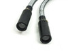 Close-up of both dual output tips showing circular fiber bundle lenses inside black cylindrical housings with yellow tape markers on metal gooseneck arms