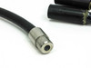 Close-up of single input end showing stainless steel barrel connector with hollow bore on black rubber cable