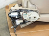 Lexus LX570 rear seat — interior view of right-side electric fold-flat actuator mechanism showing motor, gear housing, wiring connectors, and plastic mounting bracket