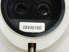Leica 10446180 light source – close-up of dual output ports and white label showing part number 10446180 with threaded brass adjustment post below