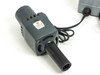 American Optical 365T lamp head close-up — finned cylindrical housing, empty bulb socket visible, output snout tube, American Optical label on housing