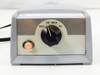 American Optical 365 Microscope Illuminator – front panel close-up showing OFF/LO/MED/HI rotary dial and illuminated orange power indicator light