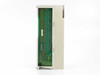 Sharp JW-64NC DC Input Module – bottom view showing PCB, backplane edge connector, and internal circuit board