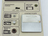 3M 716 Wrist Strap Tester — close-up of lower front panel showing resistance range selector set to 5MΩ, battery check button, wrist fastener, alligator clip, banana jack, and contact plate with rust spot