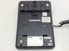 Teledex OPAL 2011S bottom/base view showing wall-mount keyway, label stickers, date code 6.0304 VXI, and coiled cord port