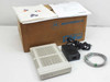 Motorola 650 ISDN modem shown in original Motorola box with power supply, RJ cable, and documentation