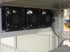Top interior of Suntek EPS rack — three large cooling fans close-up showing mounting and wiring