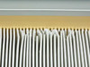 Flanders HEPA Filter pleated media closeup – dust accumulation visible at tops of pleats