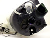 Top cover lifted open showing Mantis internal objective carousel mechanism, empty light socket (missing bulb and cover), ventilation grille, blue indicator LED, and melted plastic area near carousel mount